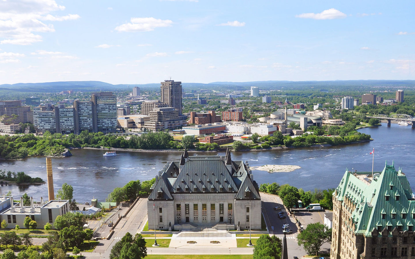 old city buildings in front of a river